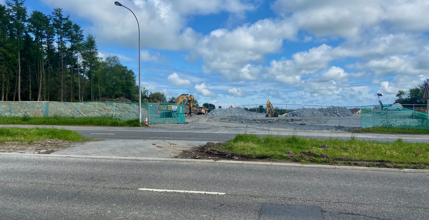 View across the A21 with excavators in
the distance and bare rock visible.