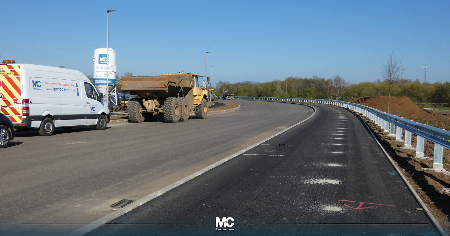 Ground level view of the new road with
                          footway and barriers in place.