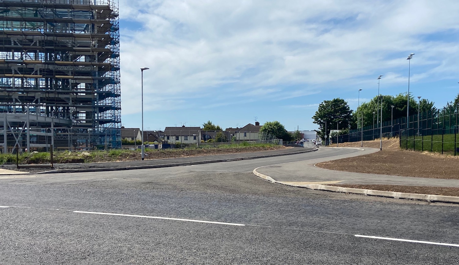 View
                          along a new road with building being built on
                          left