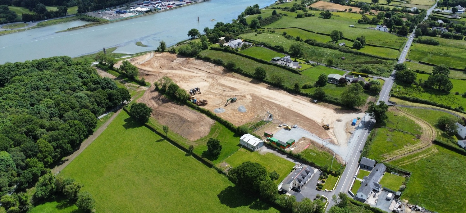 River in upper left, existing road on
bottom right. Large field between them is
completely brown having been dug over.